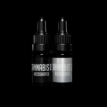 Two black bottles with 'Cannabis' labels on a black background