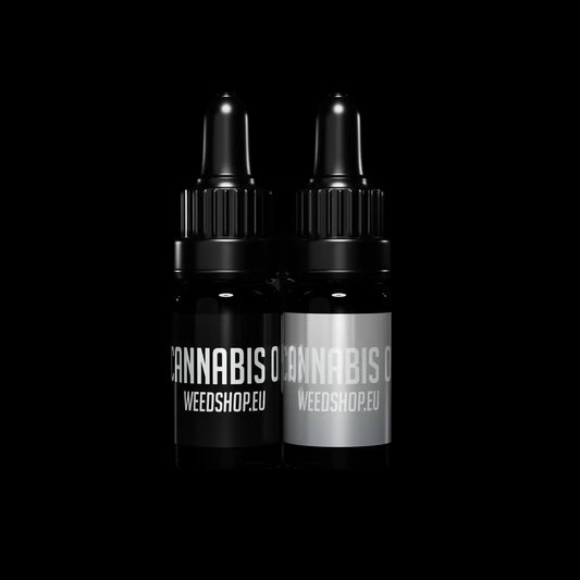 Two black bottles with 'Cannabis' labels on a black background
