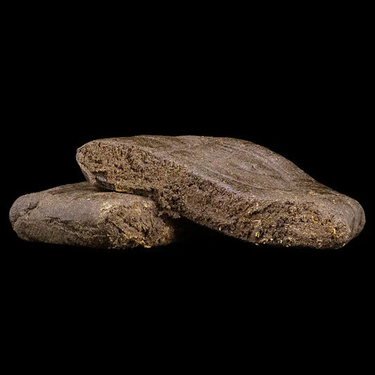 dark brown hash on a black background weedshop